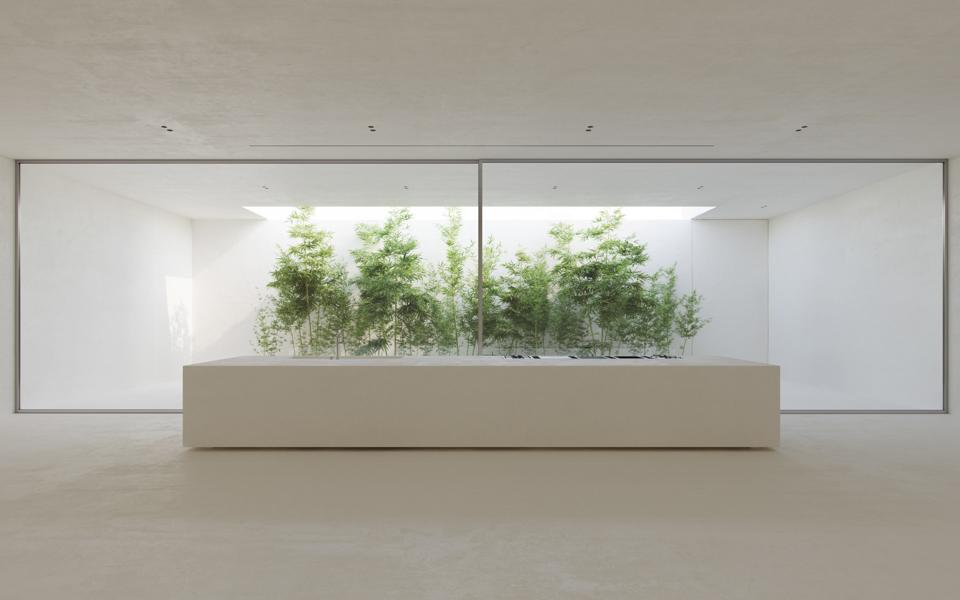 Interior Rendering of a minimalist kitchen with a monolithic island and full-height glass wall facing a bamboo-filled courtyard.